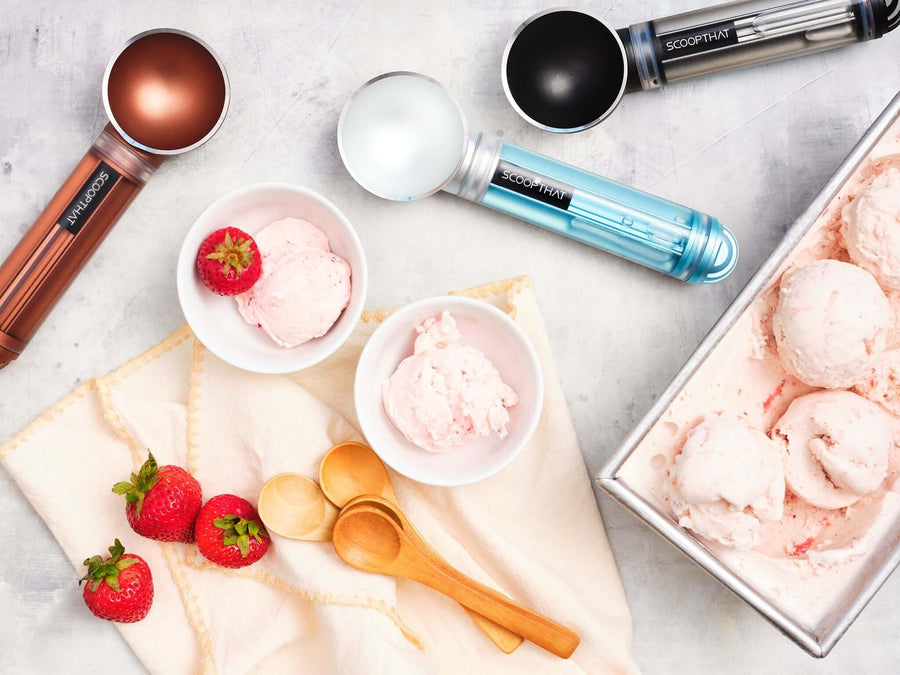 ScoopTHAT! Radii ice cream scoops with strawberry ice cream and wooden spoons on a napkin, showcasing vibrant design and functionality.