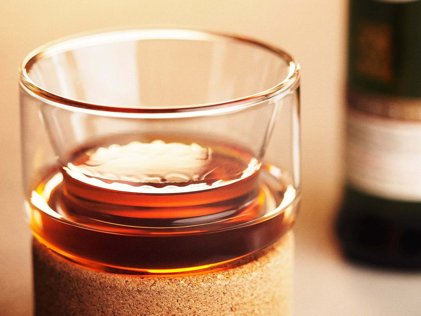 Double-walled Chill Glass keeping a drink cold, featuring refreezable liquid for undiluted refreshment, Housewares Design Awards finalist.