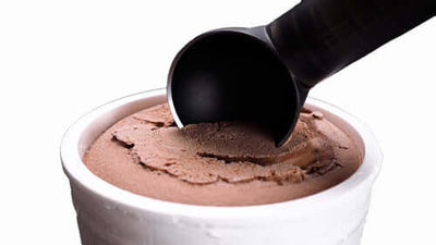 Thermo Ring Ice Cream Scoop in action, creating perfect scoops from a tub of chocolate ice cream.