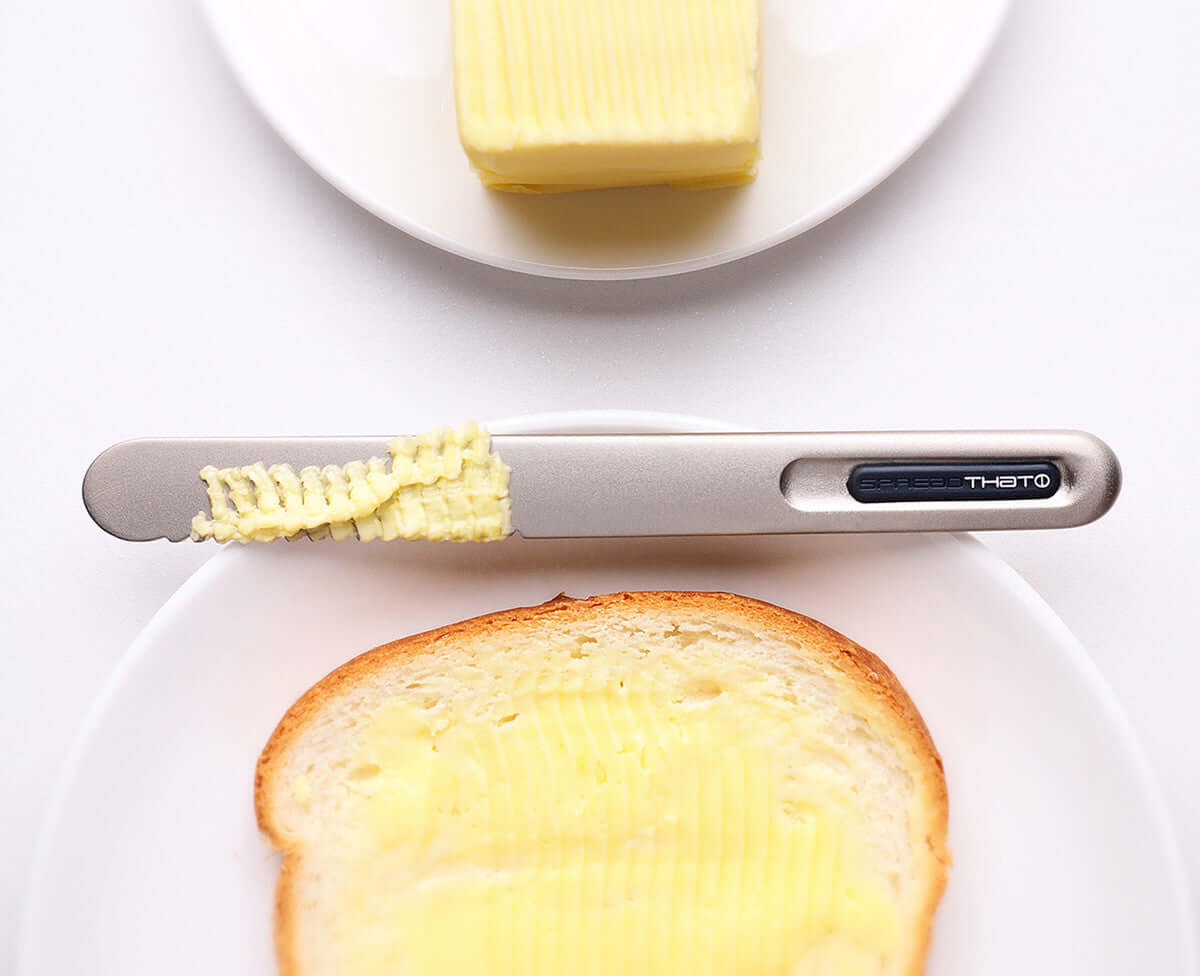 SpreadTHAT! butter knife melting and spreading butter on toast with innovative heat-conducting technology.